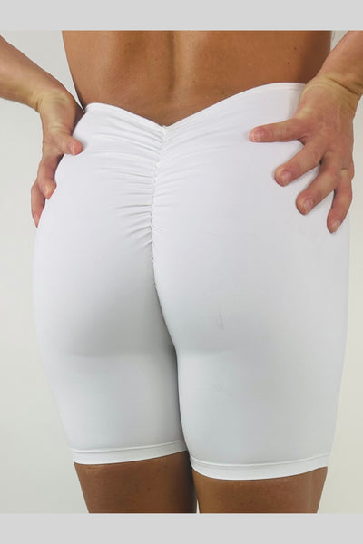 OnTheMarq DropCut™ Cloud White Shorts Jumpsuit with scrunchie rear rouging — original bathroom friendly jumpsuit — OnTheMarq proprietary DropCut™ Technology — white shorts jumpsuit — invented by Nita Marquez — Freedom Fashion