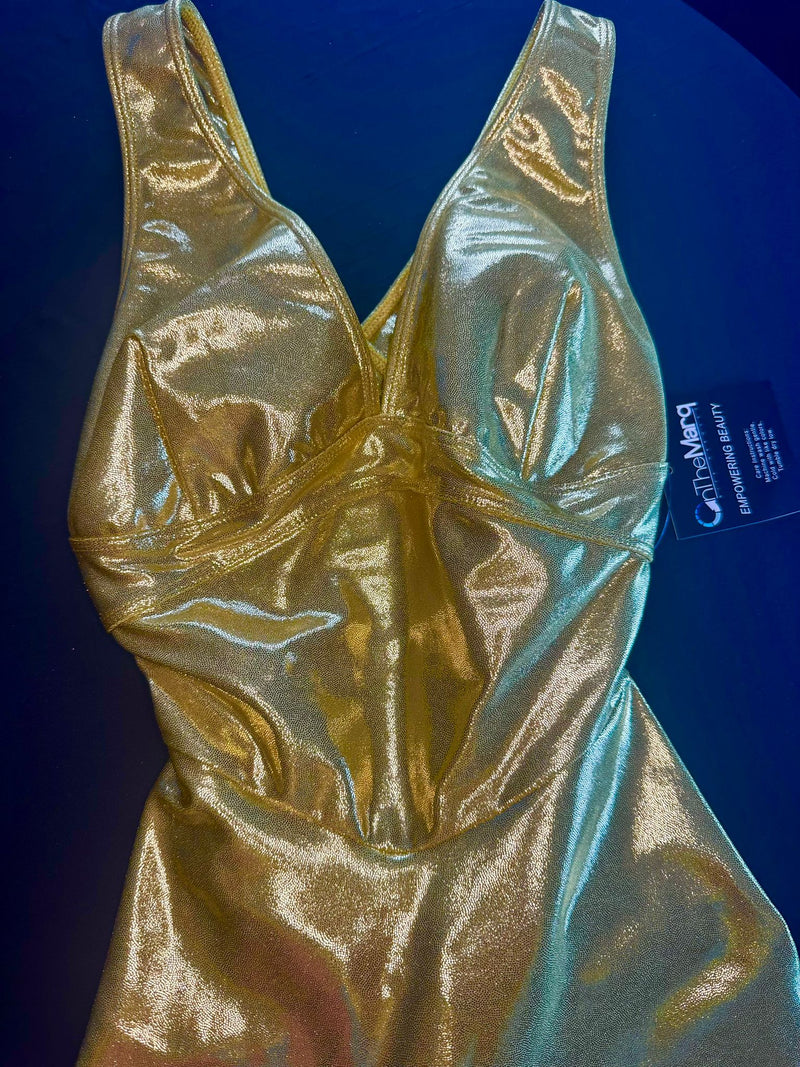 OnTheMarq DropCut™ Gold Sparkle Jumpsuit — open crossback with signature scrunchie rear rouging — original bathroom friendly jumpsuit — OnTheMarq proprietary DropCut™ Technology — holographic gold sparkle crossback jumpsuit — invented by Nita Marquez — Freedom Fashion