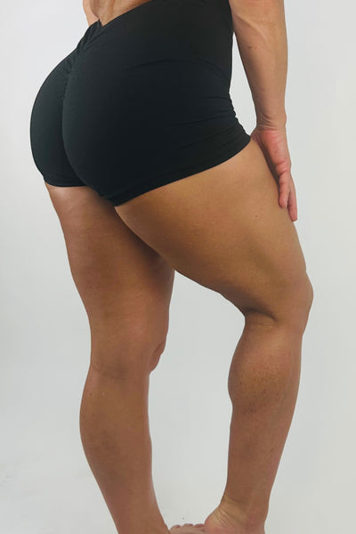 OnTheMarq DropCut™ Not-So-Basic Black Shorts Jumpsuit with scrunchie rear ruching — original bathroom friendly jumpsuit — OnTheMarq proprietary DropCut™ Technology — black shorts jumpsuit — invented by Nita Marquez — Freedom Fashion