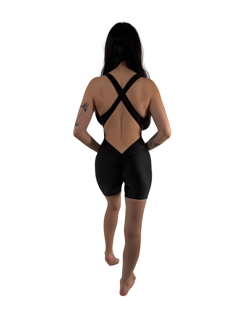 OnTheMarq DropCut™ Scrunchie Black Spandex Shorts Jumpsuit — open crossback with signature scrunchie rear ruching — original bathroom friendly jumpsuit — OnTheMarq proprietary DropCut™ Technology — black spandex shorts jumpsuit — invented by Nita Marquez — Freedom Fashion