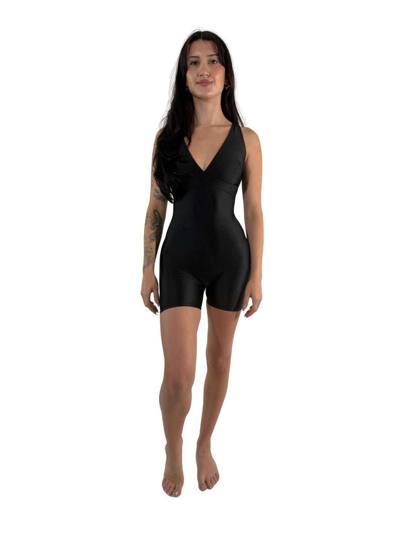 OnTheMarq DropCut™ Scrunchie Black Spandex Shorts Jumpsuit — open crossback with signature scrunchie rear ruching — original bathroom friendly jumpsuit — OnTheMarq proprietary DropCut™ Technology — black spandex shorts jumpsuit — invented by Nita Marquez — Freedom Fashion