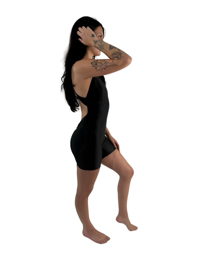 OnTheMarq DropCut™ Scrunchie Black Spandex Shorts Jumpsuit — open crossback with signature scrunchie rear ruching — original bathroom friendly jumpsuit — OnTheMarq proprietary DropCut™ Technology — black spandex shorts jumpsuit — invented by Nita Marquez — Freedom Fashion