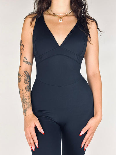 OnTheMarq DropCut™ Scrunchie Not-So-Basic Black Jumpsuit — open crossback with signature scrunchie rear ruching — original bathroom friendly jumpsuit — OnTheMarq proprietary DropCut™ Technology — invented by Nita Marquez — Freedom Fashion