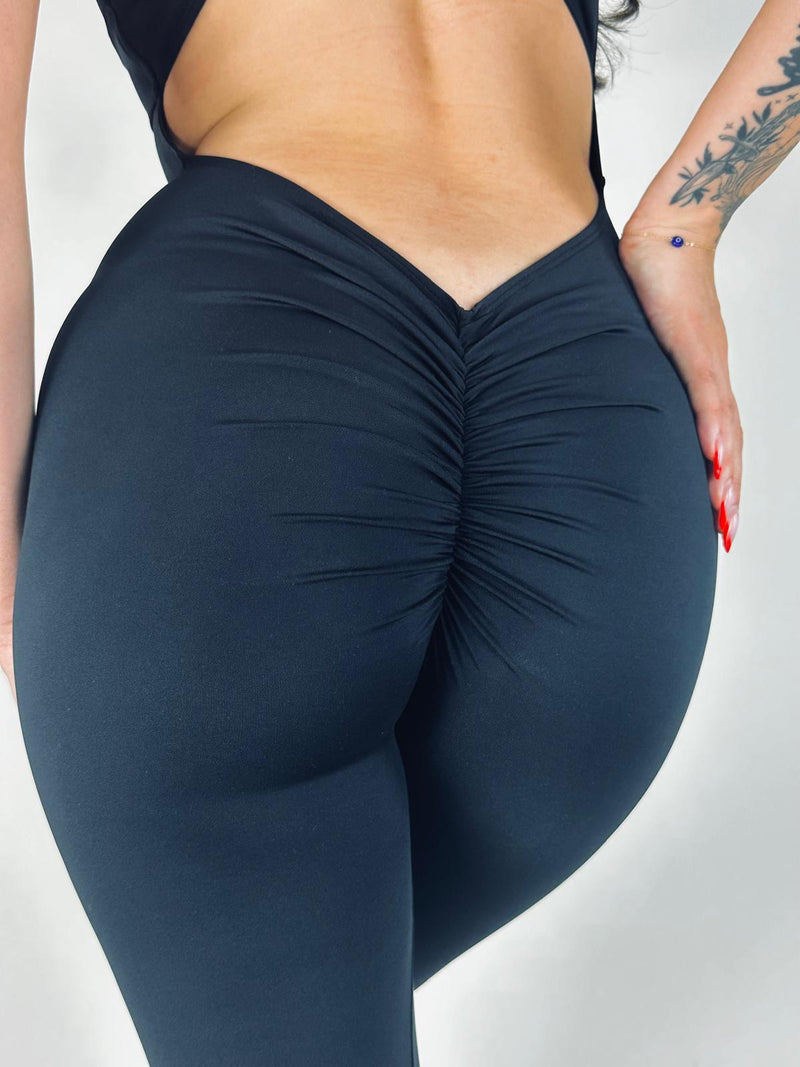 OnTheMarq DropCut™ Scrunchie Not-So-Basic Black Jumpsuit — open crossback with signature scrunchie rear ruching — original bathroom friendly jumpsuit — OnTheMarq proprietary DropCut™ Technology — invented by Nita Marquez — Freedom Fashion