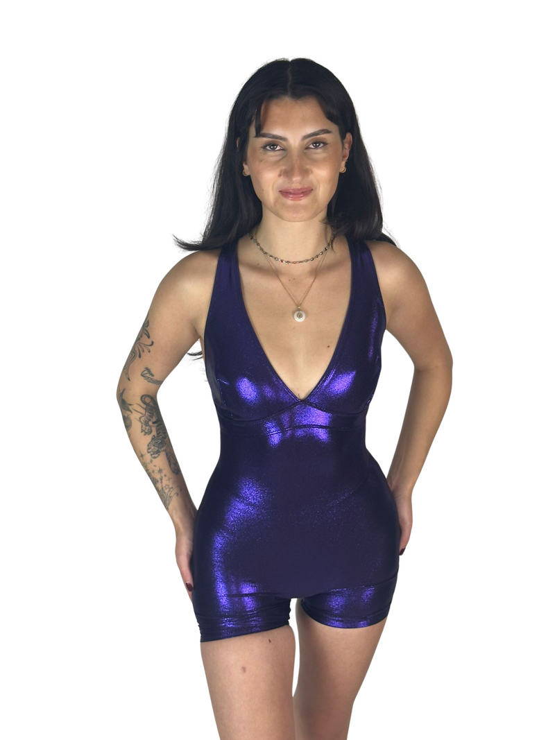 OnTheMarq DropCut™ Scrunchie Purple Sparkle Shorts Jumpsuit — open crossback with signature scrunchie rear rouging — original bathroom friendly jumpsuit — OnTheMarq proprietary DropCut™ Technology — royal purple metallic sparkle shorts jumpsuit — invented by Nita Marquez — Freedom Fashion
