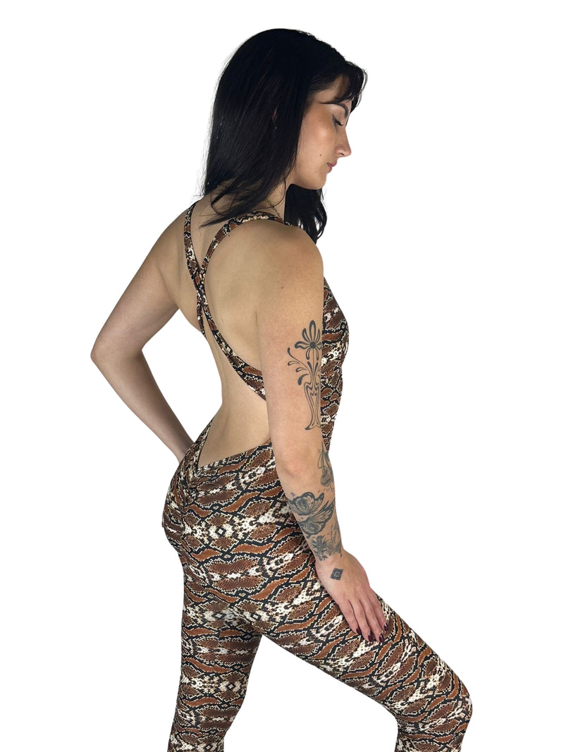 OnTheMarq DropCut™ Scrunchie Snakeskin Jumpsuit — open crossback with signature scrunchie rear ruching — original bathroom friendly jumpsuit — OnTheMarq proprietary DropCut™ Technology — brown cream black snakeskin print crossback jumpsuit — invented by Nita Marquez — Freedom Fashion