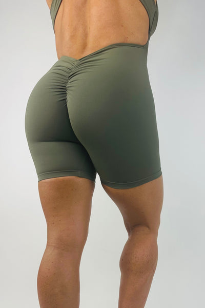 OnTheMarq DropCut™ Soft Olive Shorts Jumpsuit with scrunchie rear rouging — original bathroom friendly jumpsuit — OnTheMarq proprietary DropCut™ Technology — olive shorts jumpsuit — invented by Nita Marquez — Freedom Fashion